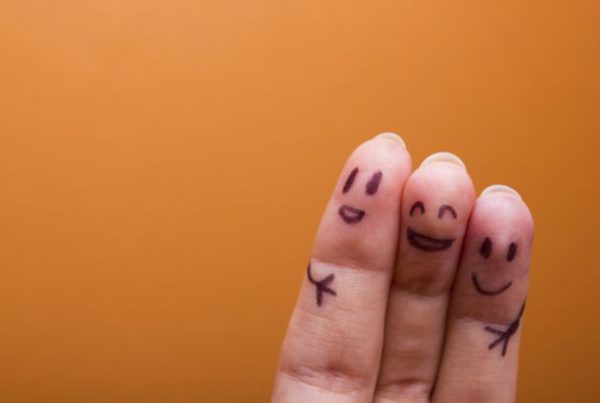 three smiling fingers that are very happy to be friends, family concept